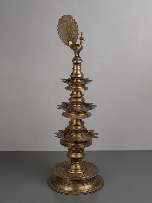 oil lamp with peacock finial