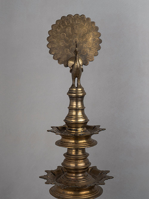 oil lamp with peacock finial